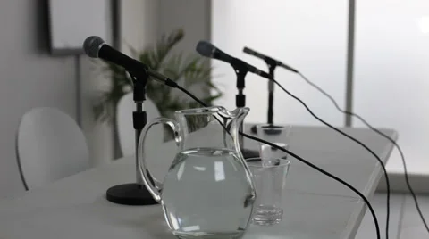 Microphones at table, dolly Stock Footage 32716051