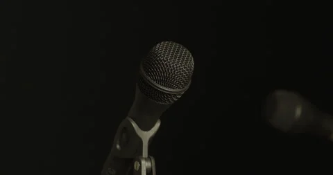 Microphones transition from light to obscurity elegantly Video stock 246964906