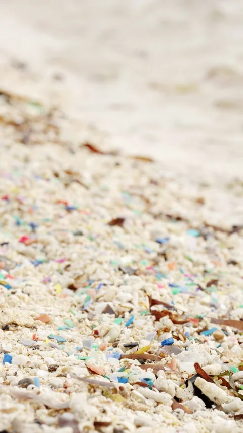 Microplastic on beach, plastic particles in sand, ocean pollution Stock Footage 306725374