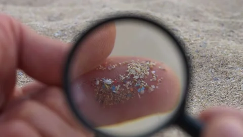 Microplastic contamination on the beaches worldwide. Micro plastics visual Vidéo 220734107