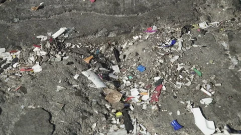 MICROPLASTIC fragments lying on the ground Stock Footage 263611846