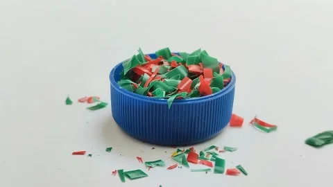 Microplastic particles on white background. plastic pieces Stock Footage 312535371