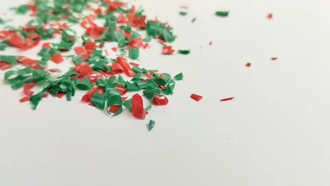 Microplastic particles on white background. plastic pieces Stock Footage 312535379