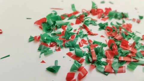 Microplastic particles on white background. plastic pieces Stock Footage 312535423