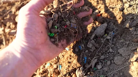 Microplastic pollution. Microplastics in ground. Stock Footage 278221558