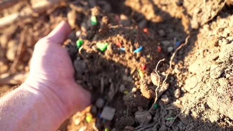 Microplastic pollution. Microplastics in ground. Stock Footage 278221942