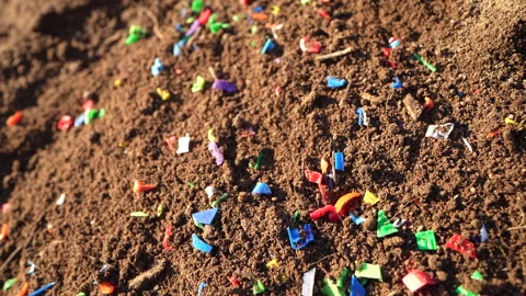 Microplastic pollution. Microplastics in ground. Video stock 278223769