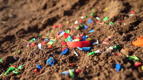 Microplastic pollution. Microplastics in ground. Video stock 278223774