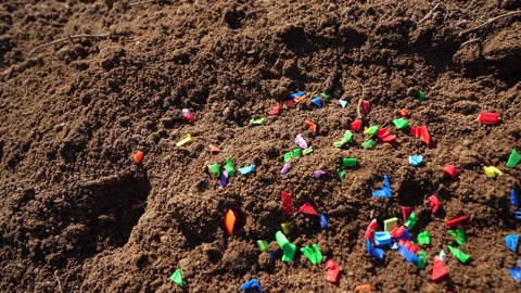 Microplastic pollution. Microplastics in ground. Soil microplastics Stock Footage 278223033