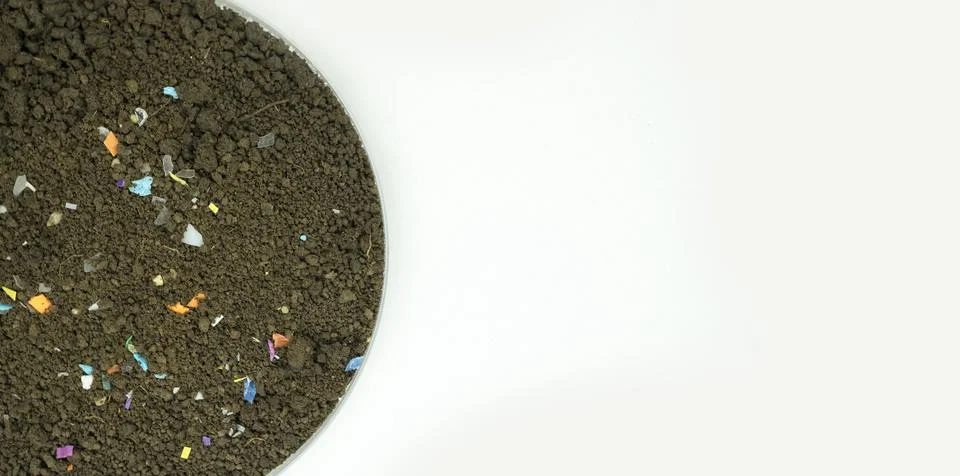 Microplastics inside the soil. Stock Photos