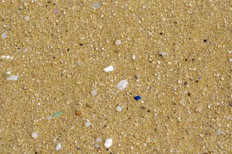 Microplastics on Sandy Beach Environmental Concern for backround Stock Photos