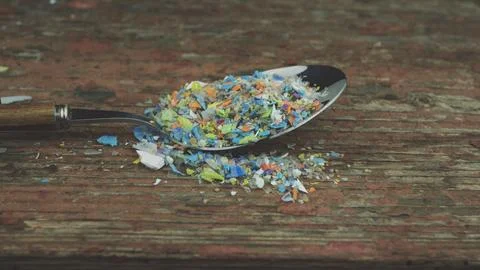 Microplastics in a spoon. Stock Photos