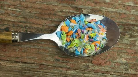 Microplastics in a spoon. Stock Photos