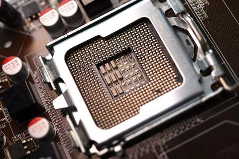 Microprocessor and socket on the motherboard. Computer radio components. Mi.. Stock Photos