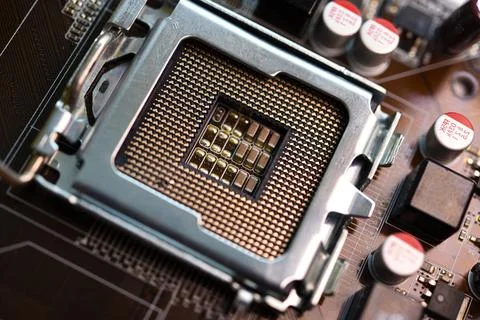 Microprocessor and socket on the motherboard. Computer radio components. Mi.. Stock Photos