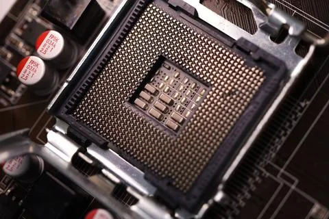 Microprocessor and socket on the motherboard. Computer radio components. Mi.. Stock Photos