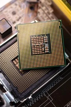 Microprocessor and socket on the motherboard. Computer radio components. Mi.. Stock Photos