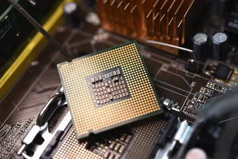 Microprocessor and socket on the motherboard. Computer radio components. Mi.. 스톡 사진