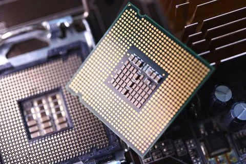 Microprocessor and socket on the motherboard. Computer radio components. Mi.. 스톡 사진