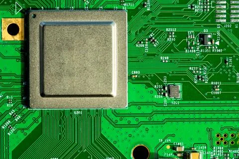 Microprocessor chip on green motherboard Stock Photos