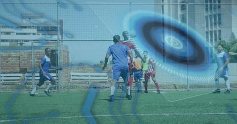 Microprocessor connections and round scanner against two teams of male soccer 스톡 사진