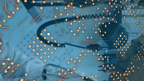 Microprocessor connections over asian male doctor teaching to use magnifying Stock Footage 312619051