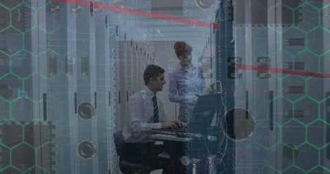 Microprocessor connections over caucasian male and female engineers working at Stockbeeldmateriaal 327897473
