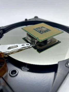 Microprocessor CPU on hard disk plate and reflections closeup view with selec Stockfoto's