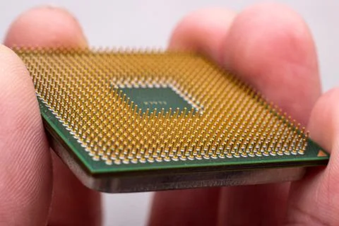 Microprocessor in hand. Photos