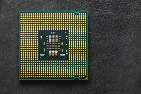 The microprocessor processor of the CPU of a computer or laptop lies on a dark 写真素材