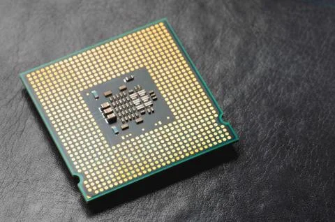 The microprocessor processor of the CPU of a computer or laptop lies on a dark Foto stock