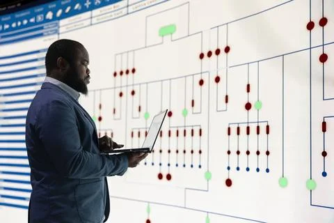 Microprocessor production, laptop and RD engineer in industrial plant Stock Photos