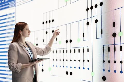 Microprocessor production, tablet and manager overseeing factory using screen Foto stock