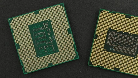 Microprocessors with Gold Contact Pins on Dark Surface Stock Footage 337009875