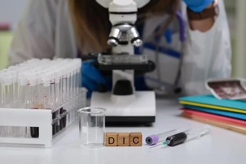 Microscope and Laboratory Equipment Being Utilized in Ongoing Research and Stock Photos