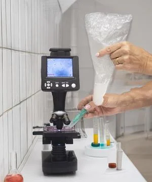 Microscope and sperm in clinic Stock Photos