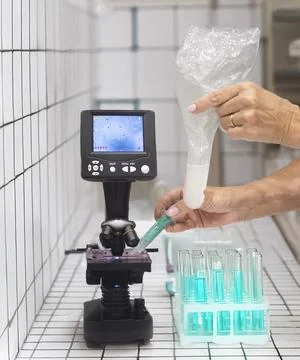 Microscope and sperm in clinic Stock Photos