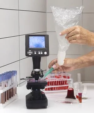 Microscope and sperm in clinic Stock Photos