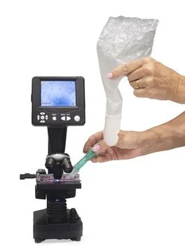 Microscope and sperm in studio Stock Photos