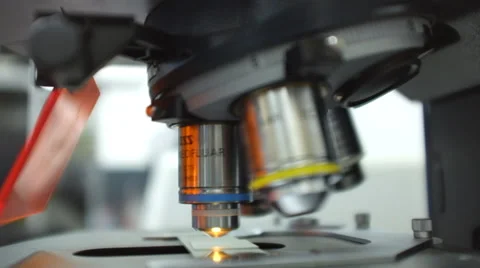 Microscope automatically turns for the focus at a laboratory Stock Footage 35198460