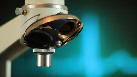 Microscope on the background of cardiogram Stock Footage 114387114