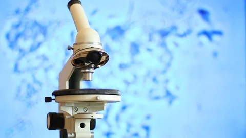 Microscope on the background of moving bacterias Video stock 114386792