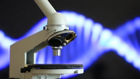 Microscope on the background of rotating DNA Vídeos de archivo 114386987