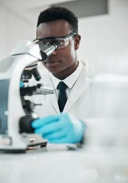 Microscope, black man and analytics with research, medical and experiment for Stock Photos