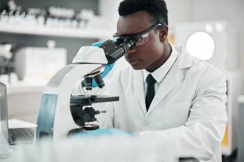 Microscope, black man or biotechnology with research, medical or data analysis Stock Photos