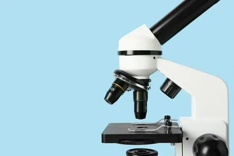 Microscope on blue background. Nobel Prize Day Photos