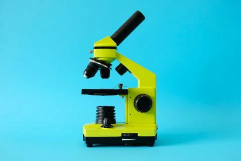 Microscope on a bright blue background. High quality photo. Stock Photos