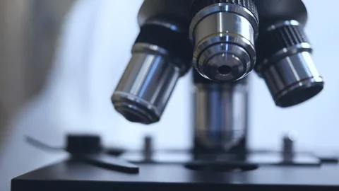 Microscope close-up. automated research. search for germs and viruses. Video stock 129970012