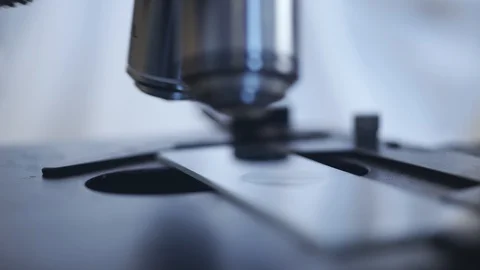 Microscope close-up. automated research. search for germs and viruses. Video stock 129970923