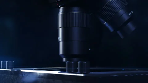 The microscope close-up. the camera does a 360 degree flyover around the lens Stock Footage 195024409